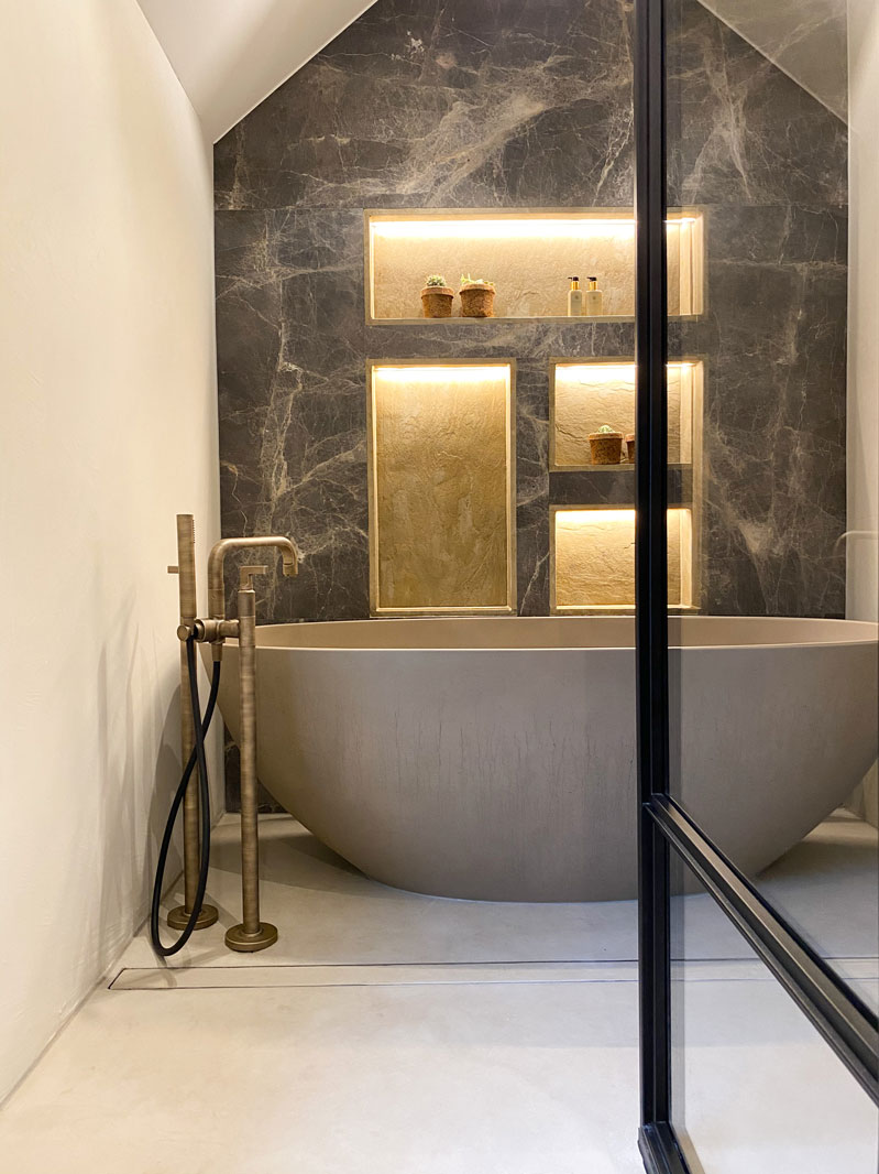 Marble bathroom with concrete tub